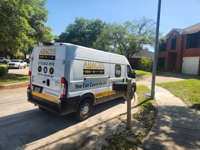 Abacus Plumbing service van at a residential job site